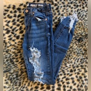 High rise ripped blu jeans.